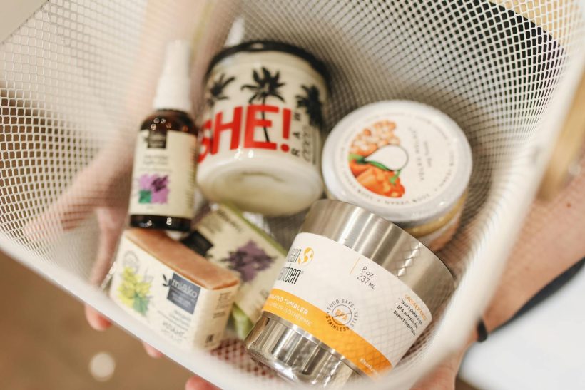 A basket containing various eco-friendly and natural products.