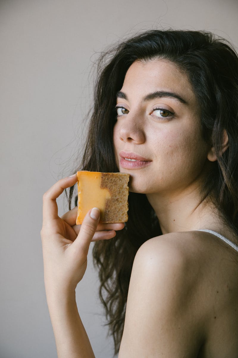 Woman in İstanbul holding organic soap, promoting natural skincare.